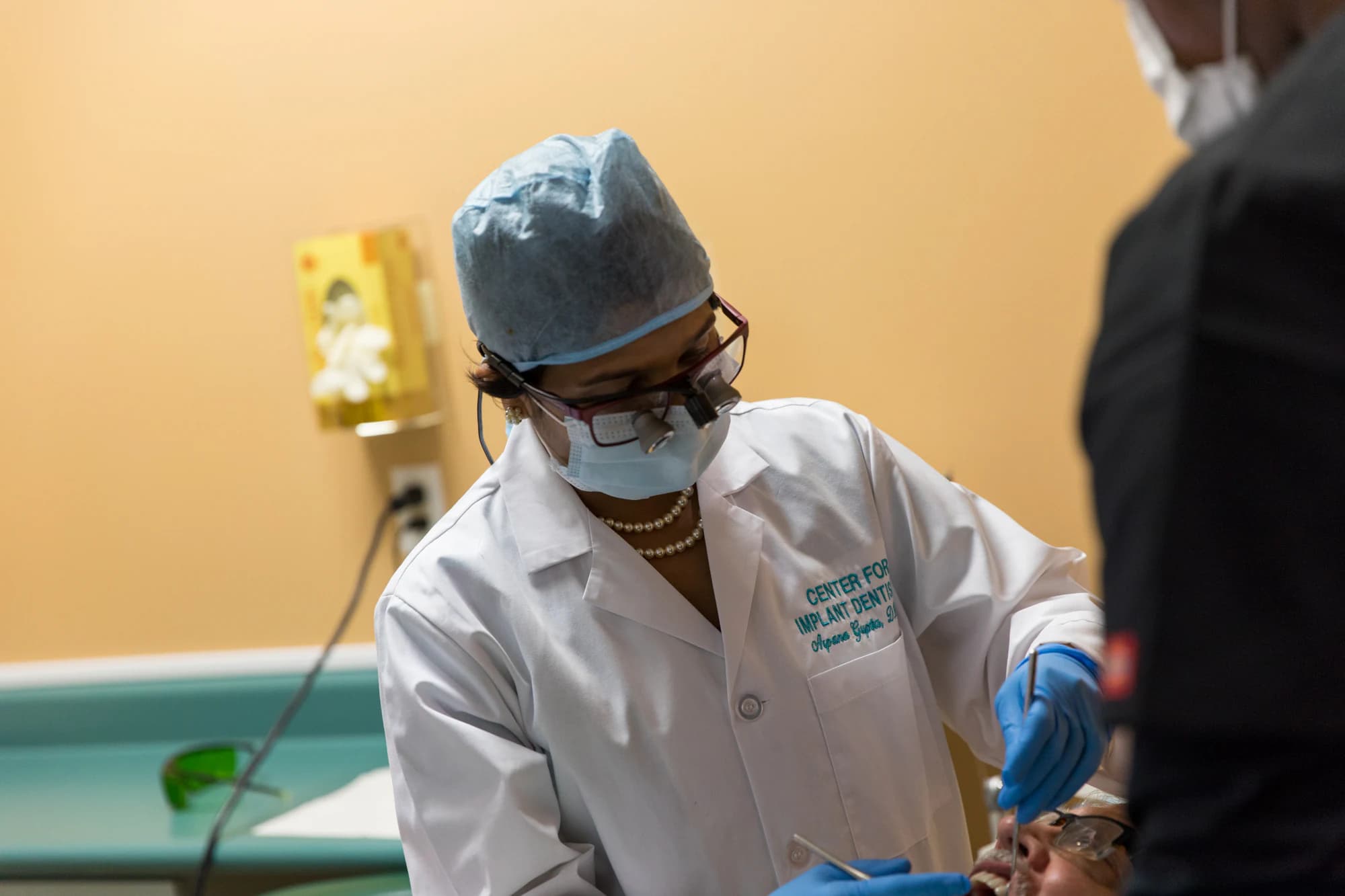 Dr. Arpana Gupta performing guided dental implant treatment