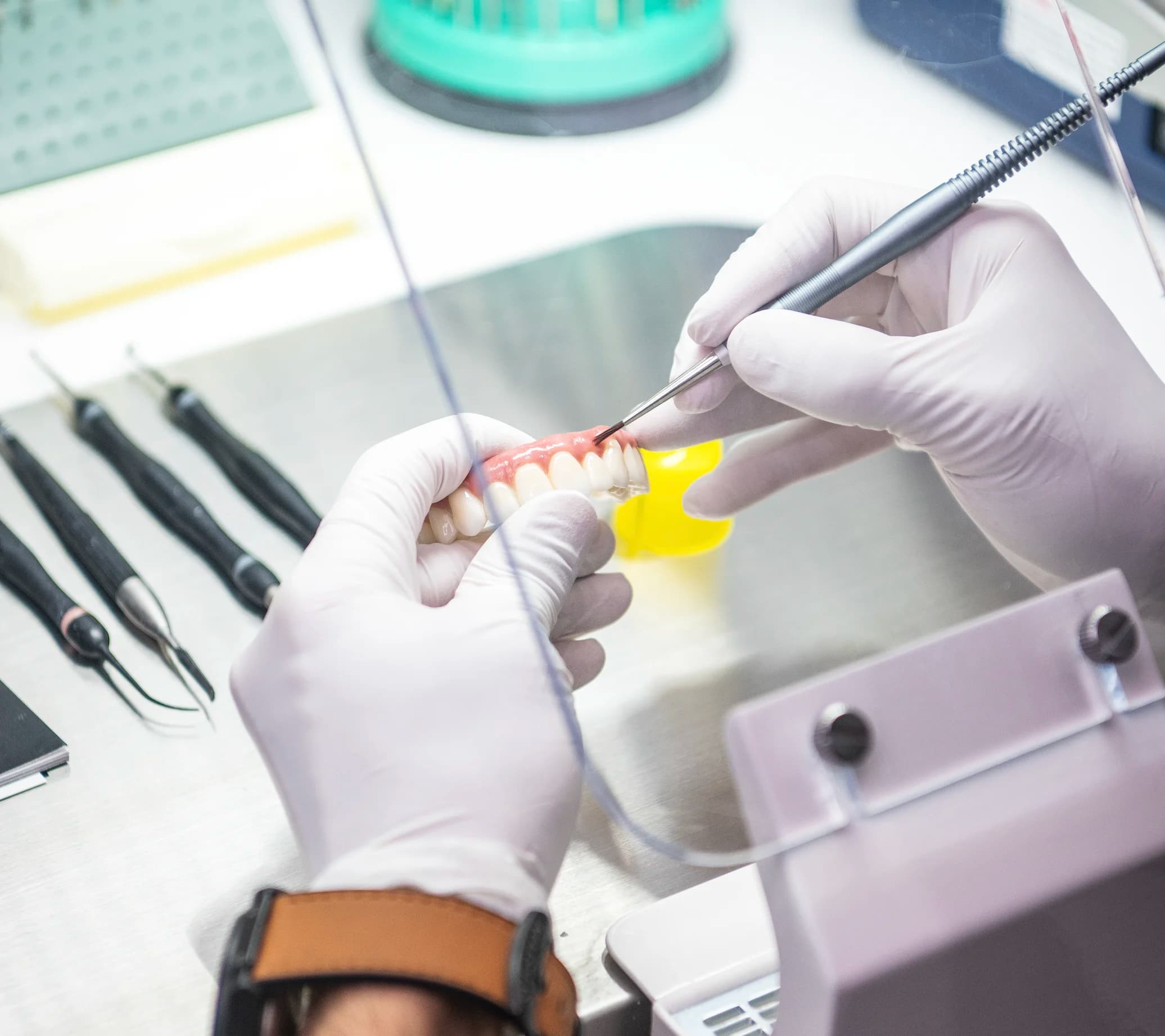 A prosthesis being adjusted at the lab bench