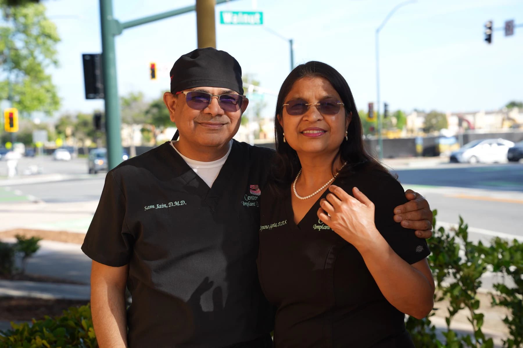 Dr. Sam Jain and Dr. Arpana Gupta outside the practice