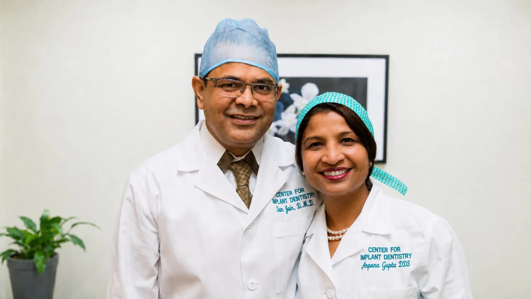 Dr. Sam Jain and Dr. Arpana Gupta together in white coats