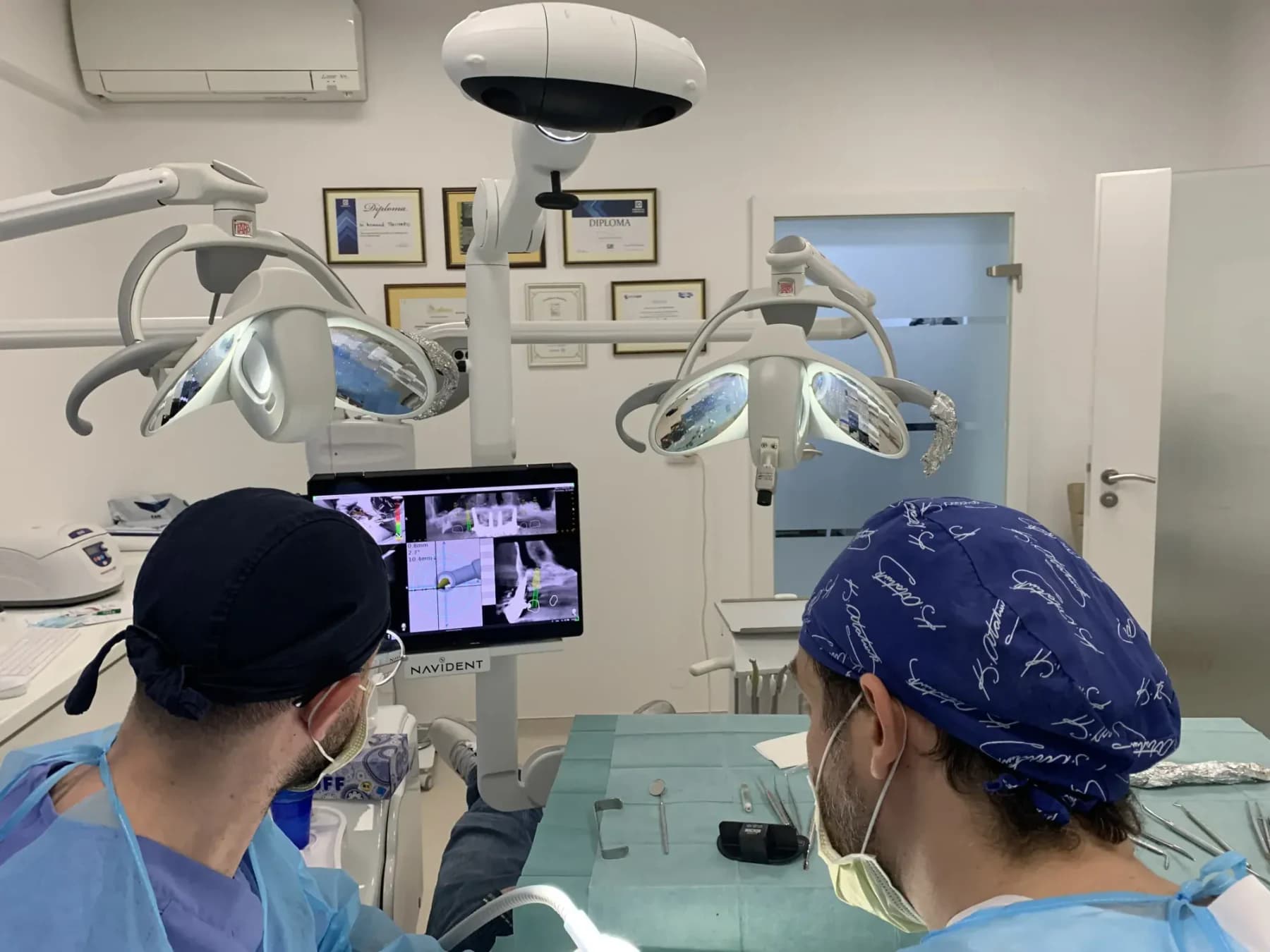 A clinical team using dynamic navigation during implant surgery