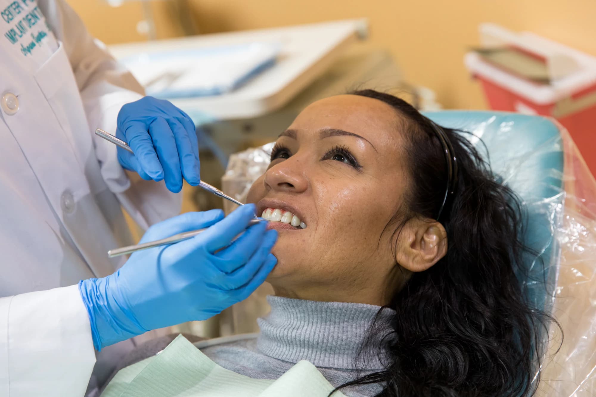A patient being examined at the chair