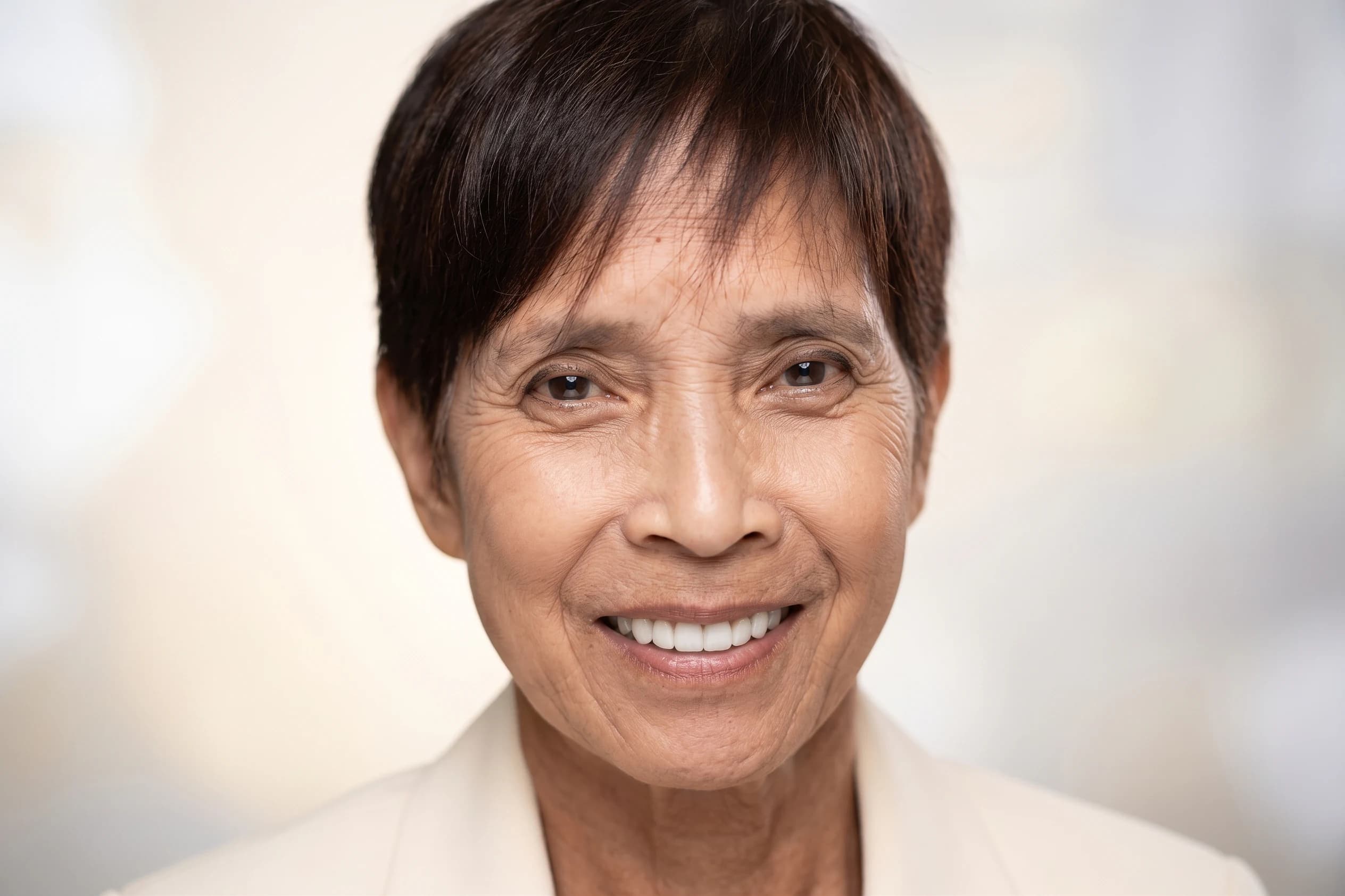A senior patient smiling in the treatment chair