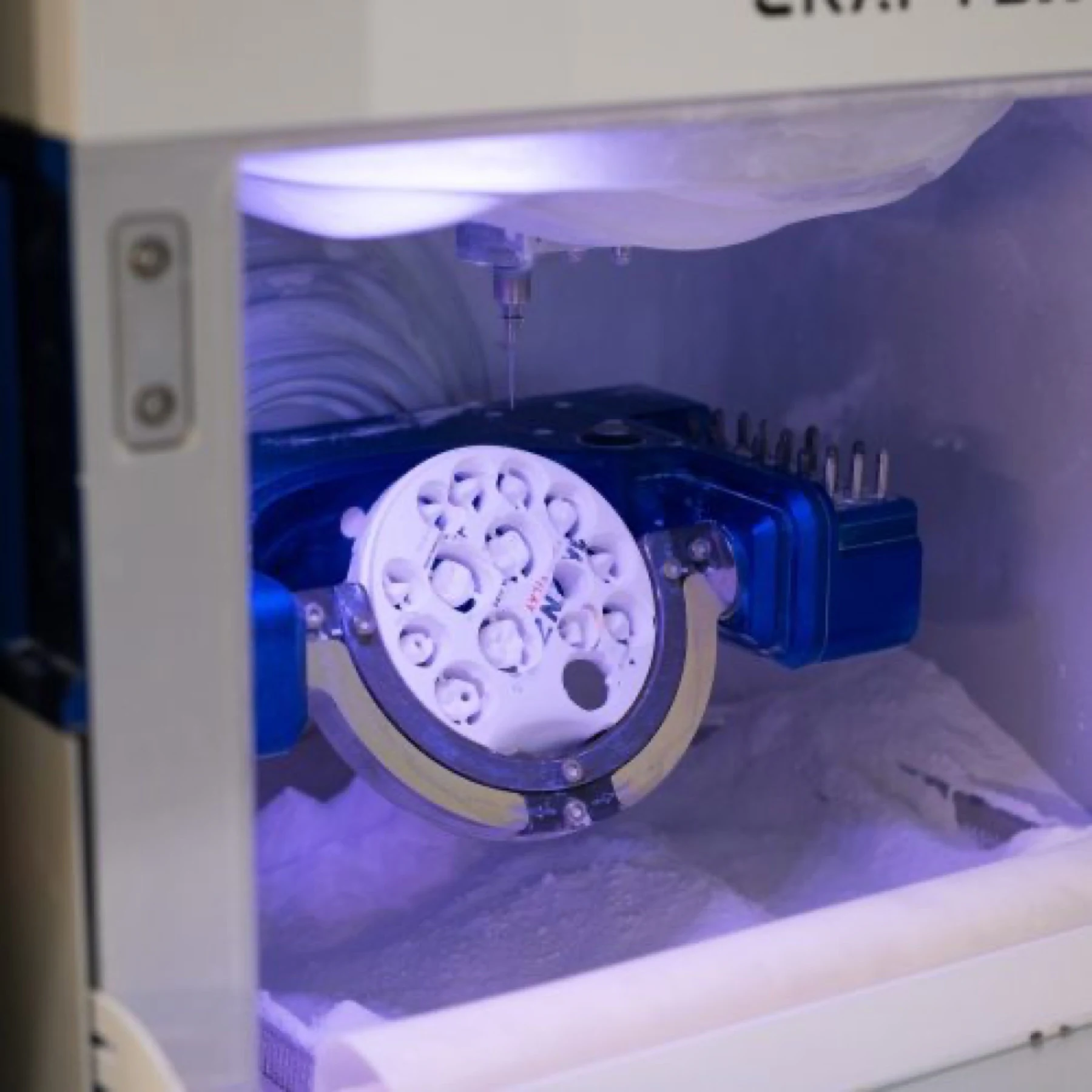 A zirconia disc under way inside the milling chamber
