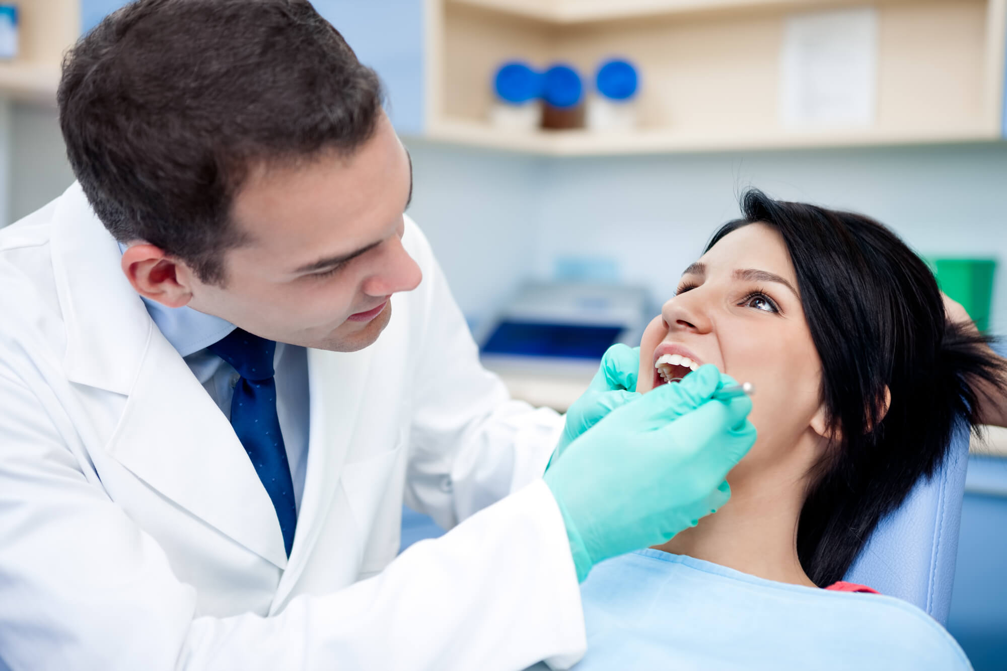a dentist checking a patient's Affordable Dental Implants in San Francisco