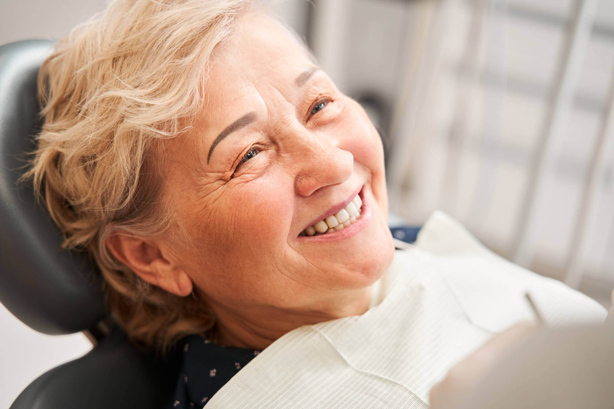 patient asking about the Cost of All on 4 Dental Implants